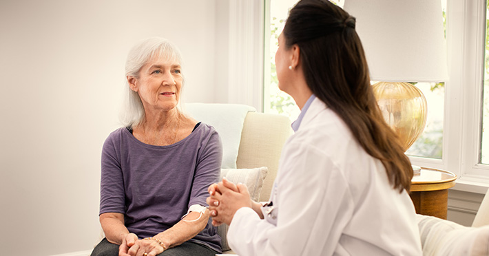 Health care worker and woman in a discussion